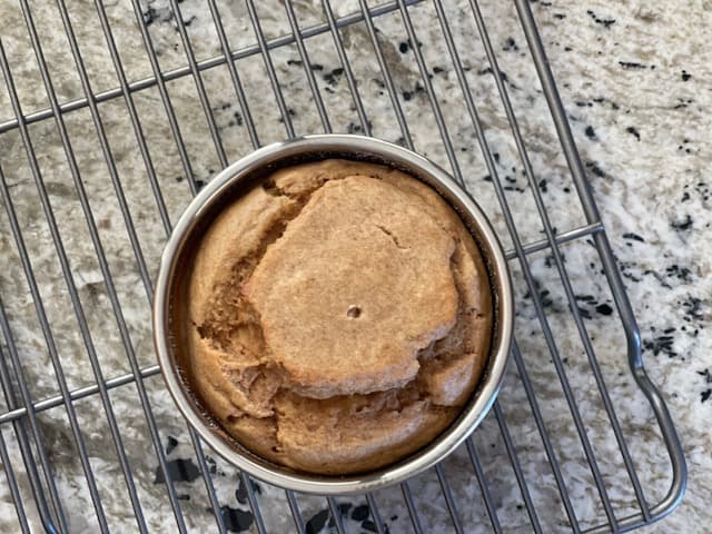 Cashew butter and banana dog birthday cake cooling on rack in pan Cashew butter and banana dog birthday cake cooling on rack in pan