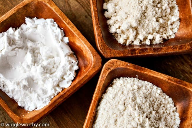 Gluten free flours in small wooden bowls Gluten free flours in small wooden bowls