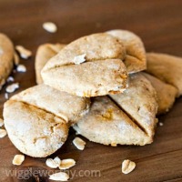 Gluten free peanut butter dog treats on wooden board