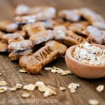 peanut butter and carrot dog treats on wooden table