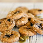 Homemade pumpkin blueberry dog treats on wooden board