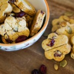 Pumpkin cranberry and turkey dog treats in bowl on wooden tray