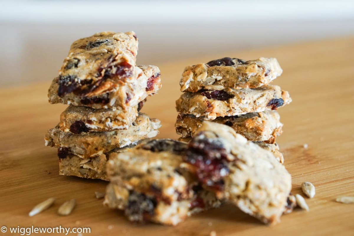 Sunflower seed power bar dog treats stacked on bamboo cutting board Sunflower seed power bar dog treats stacked on bamboo cutting board